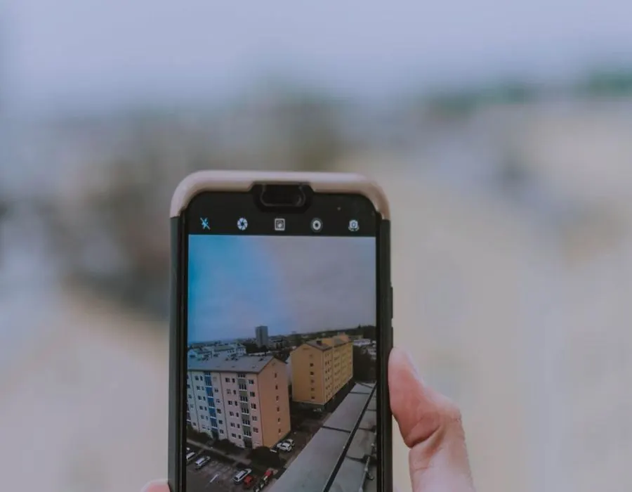 Phone camera being used to photograph a building